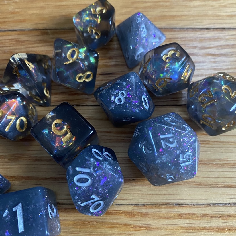 polyhedral dice with shiny foil and glitter inside them